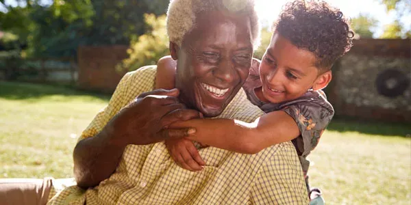 Grandfather and grandson playing outside